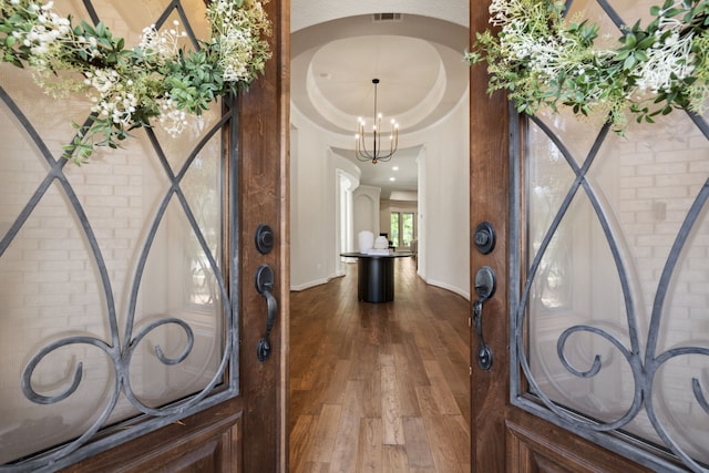 4051 Ashland Woods Dr, Spring, TX 77386 - entryway with dark wood-type flooring, baseboards, and a chandelier
