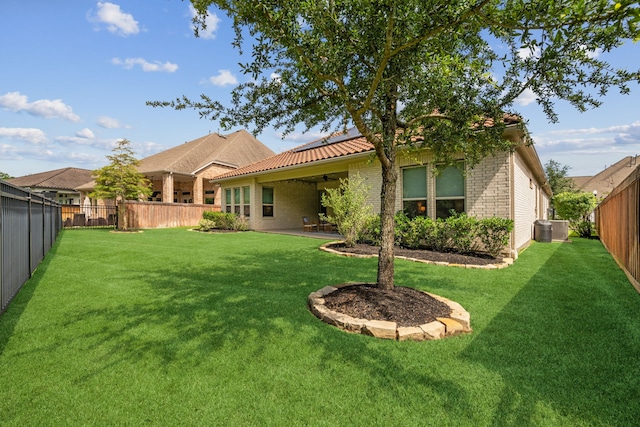 4051 Ashland Woods Dr, Spring, TX 77386 - back of house featuring a ceiling fan, brick siding, and a tile roof