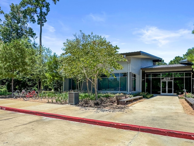 4051 Ashland Woods Dr, Spring, TX 77386 - back of house featuring french doors and a sunroom