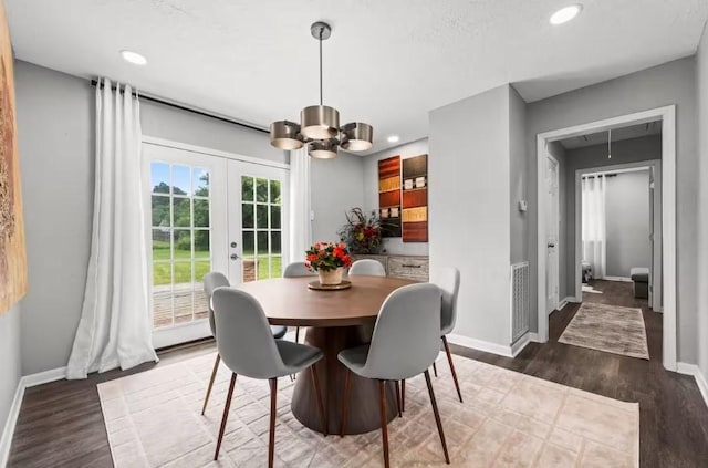 7280 Click Dr, Beaumont, TX 77708 - dining space featuring a chandelier, french doors, baseboards, dark wood-style flooring, and recessed lighting
