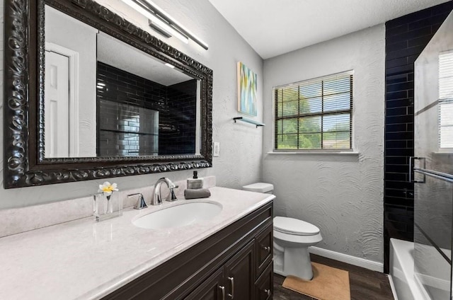 7280 Click Dr, Beaumont, TX 77708 - full bathroom featuring vanity, wood finished floors, toilet, baseboards, and shower / bathtub combination