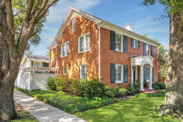 2256 Dryden Rd, Houston, TX 77030 - view of front of house with brick siding and a chimney