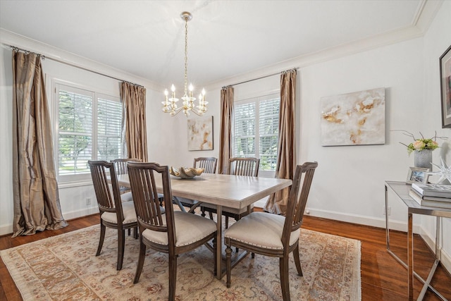2256 Dryden Rd, Houston, TX 77030 - dining space featuring crown molding, plenty of natural light, a chandelier, wood finished floors, and baseboards