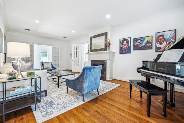 2256 Dryden Rd, Houston, TX 77030 - living area featuring crown molding, wood finished floors, a fireplace, baseboards, and recessed lighting