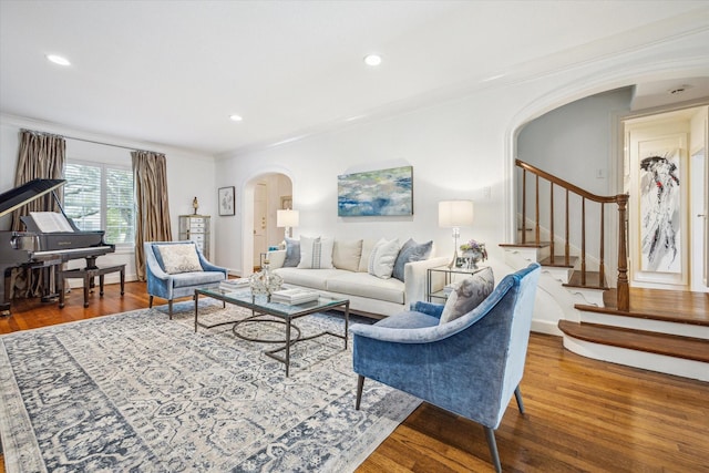 2256 Dryden Rd, Houston, TX 77030 - living room with arched walkways, wood finished floors, stairs, ornamental molding, and recessed lighting