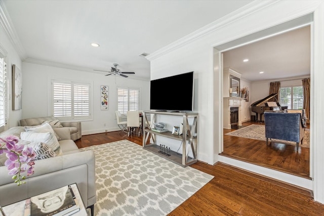 2256 Dryden Rd, Houston, TX 77030 - living room with ornamental molding, wood finished floors, recessed lighting, a ceiling fan, and baseboards