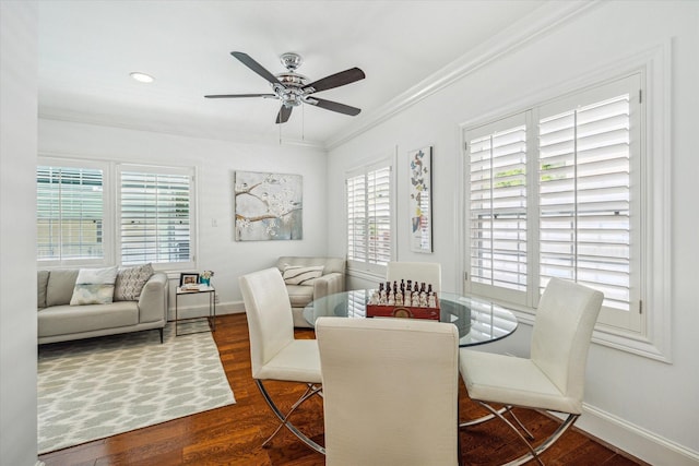 2256 Dryden Rd, Houston, TX 77030 - dining space with crown molding, healthy amount of natural light, wood finished floors, ceiling fan, and baseboards