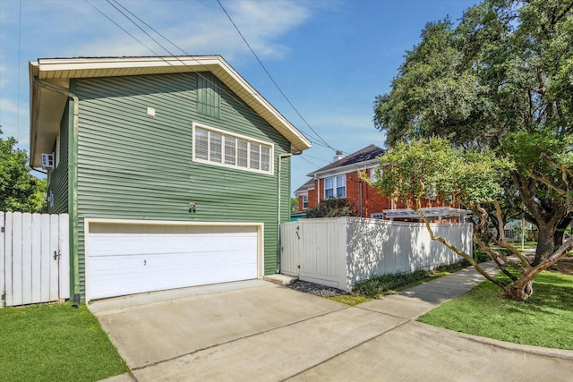 2256 Dryden Rd, Houston, TX 77030 - view of property exterior featuring driveway and a garage