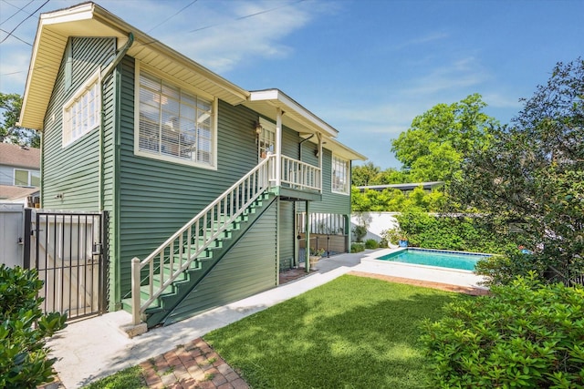 2256 Dryden Rd, Houston, TX 77030 - rear view of house with stairs and a gate