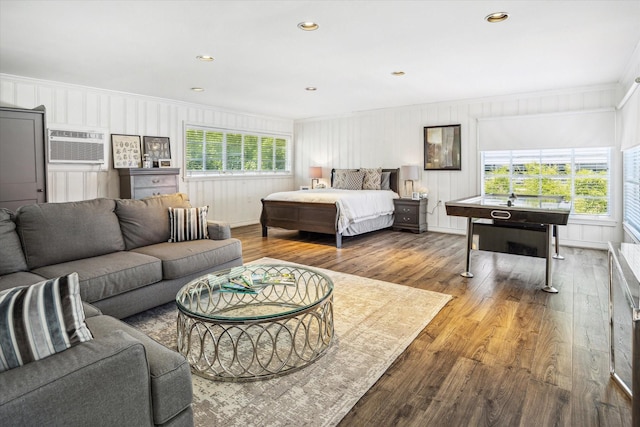 2256 Dryden Rd, Houston, TX 77030 - bedroom featuring ornamental molding, wood finished floors, a wall mounted AC, and recessed lighting