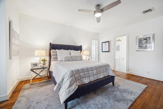 2256 Dryden Rd, Houston, TX 77030 - bedroom featuring crown molding, wood finished floors, baseboards, connected bathroom, and a ceiling fan
