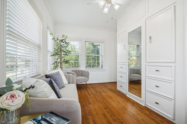 2256 Dryden Rd, Houston, TX 77030 - living room with ornamental molding, wood finished floors, ceiling fan, and baseboards
