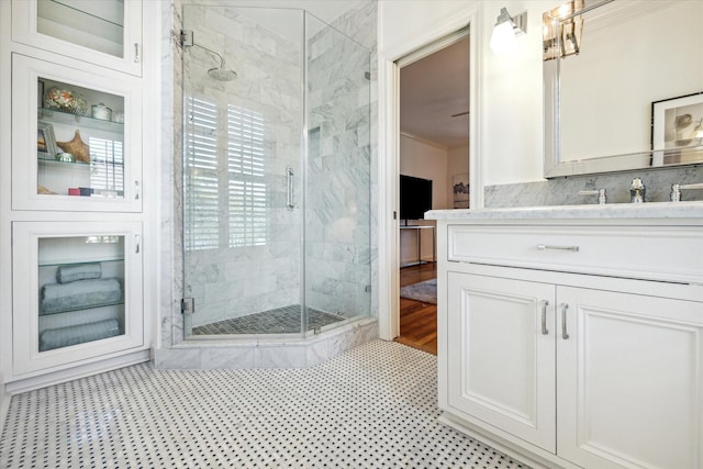2256 Dryden Rd, Houston, TX 77030 - bathroom featuring a stall shower, vanity, and crown molding
