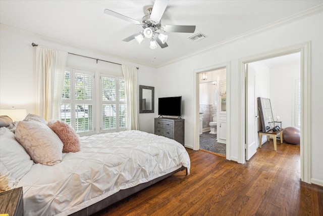2256 Dryden Rd, Houston, TX 77030 - bedroom with dark wood finished floors, ornamental molding, ceiling fan, baseboards, and ensuite bathroom