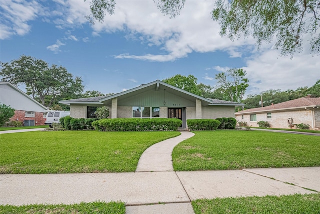 8314 Burning Hills Dr, Houston, TX 77071 - mid-century inspired home with a front lawn, brick siding, and central air condition unit