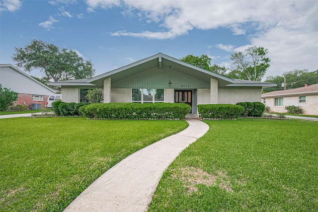 8314 Burning Hills Dr, Houston, TX 77071 - mid-century inspired home with a front lawn and brick siding