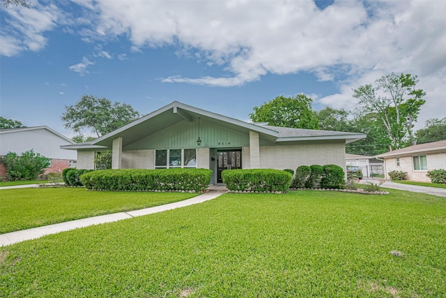 8314 Burning Hills Dr, Houston, TX 77071 - mid-century home with brick siding and a front lawn