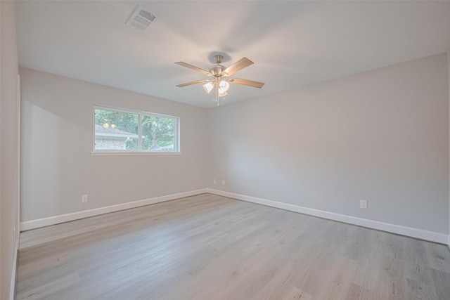 8314 Burning Hills Dr, Houston, TX 77071 - spare room featuring light wood-style floors, baseboards, and ceiling fan