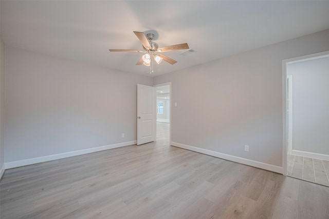 8314 Burning Hills Dr, Houston, TX 77071 - empty room featuring light wood finished floors, a ceiling fan, and baseboards