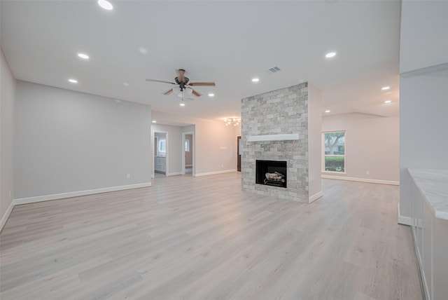 8314 Burning Hills Dr, Houston, TX 77071 - unfurnished living room featuring a ceiling fan, light wood-style floors, a fireplace, baseboards, and recessed lighting
