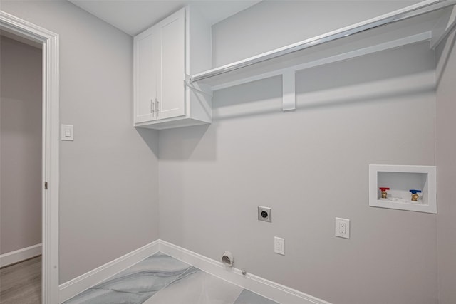 8314 Burning Hills Dr, Houston, TX 77071 - laundry room featuring hookup for an electric dryer, washer hookup, cabinet space, baseboards, and hookup for a gas dryer