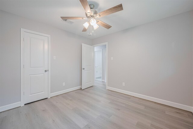 8314 Burning Hills Dr, Houston, TX 77071 - unfurnished bedroom with light wood-type flooring, baseboards, and a ceiling fan