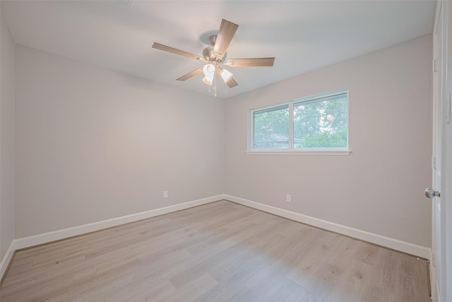 8314 Burning Hills Dr, Houston, TX 77071 - empty room featuring light wood-type flooring, baseboards, and a ceiling fan