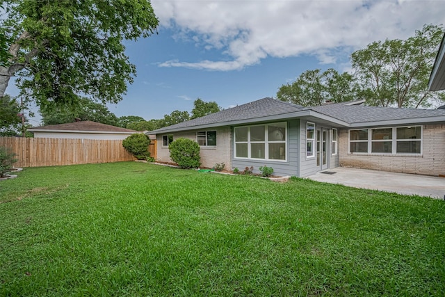 8314 Burning Hills Dr, Houston, TX 77071 - rear view of house with brick siding, a patio area, and a shingled roof