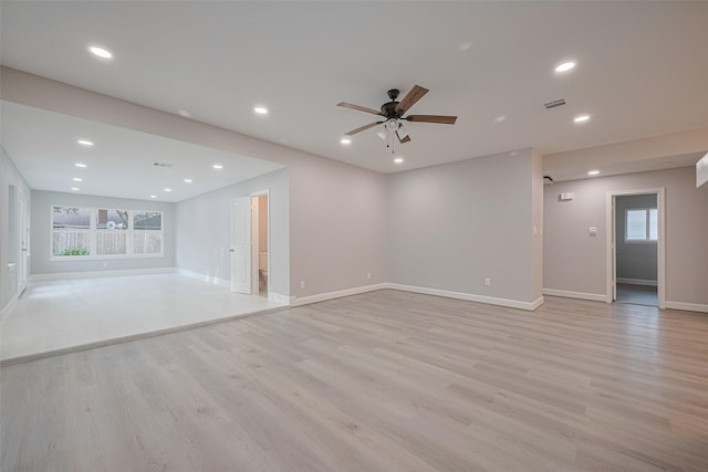 8314 Burning Hills Dr, Houston, TX 77071 - unfurnished living room with healthy amount of natural light, a ceiling fan, light wood-type flooring, baseboards, and recessed lighting