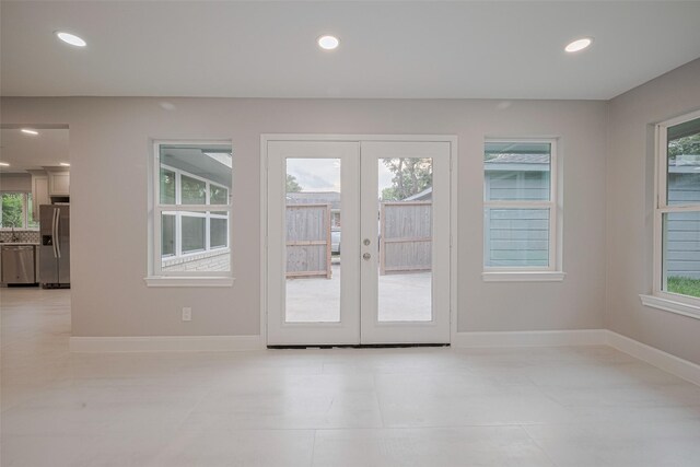 8314 Burning Hills Dr, Houston, TX 77071 - doorway to outside featuring french doors, recessed lighting, baseboards, and light tile patterned floors