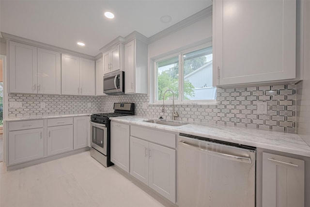8314 Burning Hills Dr, Houston, TX 77071 - kitchen with appliances with stainless steel finishes, a sink, light stone counters, backsplash, and white cabinets