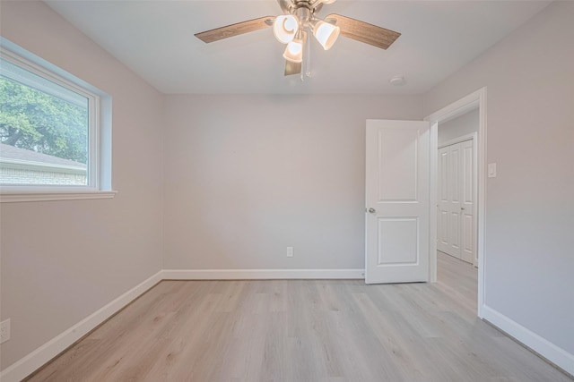 8314 Burning Hills Dr, Houston, TX 77071 - unfurnished room featuring light wood-style flooring, a ceiling fan, and baseboards
