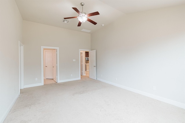 16719 Highland Country Dr, Cypress, TX 77433 - unfurnished bedroom with light carpet, baseboards, ensuite bathroom, high vaulted ceiling, and ceiling fan