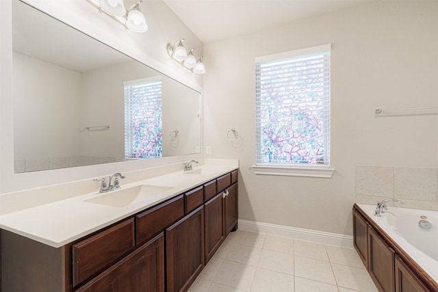 16719 Highland Country Dr, Cypress, TX 77433 - bathroom with double vanity, a garden tub, baseboards, and tile patterned floors