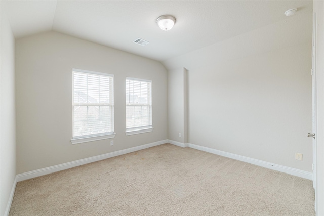16719 Highland Country Dr, Cypress, TX 77433 - spare room featuring lofted ceiling, light colored carpet, baseboards, and a smoke detector