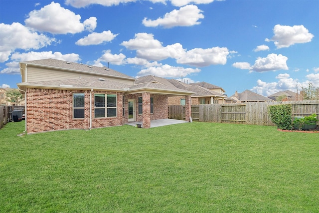 16719 Highland Country Dr, Cypress, TX 77433 - rear view of house with a patio area, brick siding, and a shingled roof