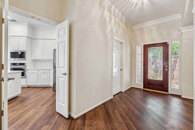 1327 Mission Chase Dr, Houston, TX 77077 - foyer with dark wood finished floors, ornamental molding, a towering ceiling, and baseboards