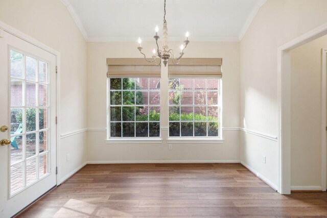1327 Mission Chase Dr, Houston, TX 77077 - unfurnished dining area featuring a chandelier, crown molding, healthy amount of natural light, and wood finished floors