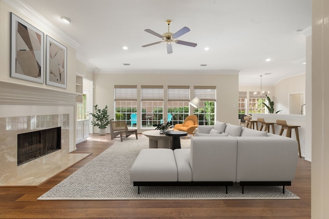 1327 Mission Chase Dr, Houston, TX 77077 - living area featuring ornamental molding, a fireplace, wood finished floors, healthy amount of natural light, and recessed lighting