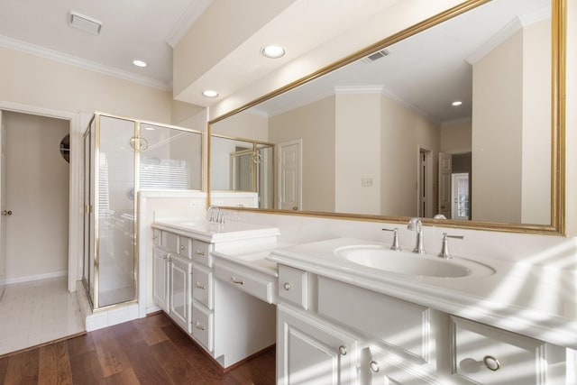 1327 Mission Chase Dr, Houston, TX 77077 - full bathroom with double vanity, a shower stall, recessed lighting, crown molding, and wood finished floors