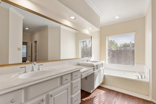 1327 Mission Chase Dr, Houston, TX 77077 - bathroom featuring double vanity, crown molding, a garden tub, wood finished floors, and recessed lighting