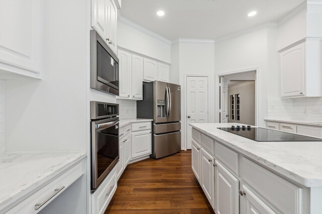 1327 Mission Chase Dr, Houston, TX 77077 - kitchen featuring appliances with stainless steel finishes, ornamental molding, dark wood finished floors, decorative backsplash, and recessed lighting