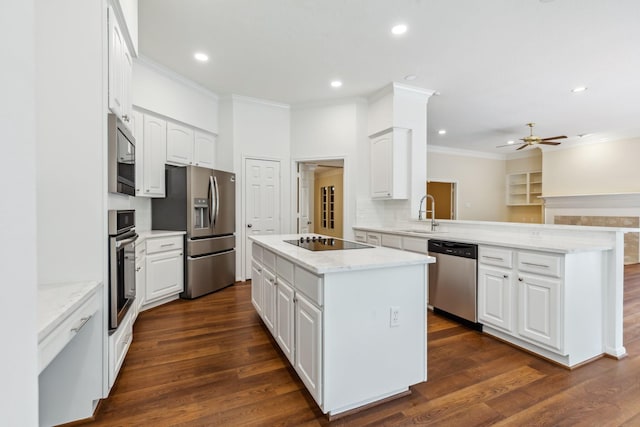 1327 Mission Chase Dr, Houston, TX 77077 - kitchen featuring appliances with stainless steel finishes, a peninsula, a kitchen island, a ceiling fan, and crown molding
