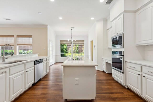 1327 Mission Chase Dr, Houston, TX 77077 - kitchen featuring stainless steel appliances, a sink, a kitchen island, dark wood-style floors, and recessed lighting