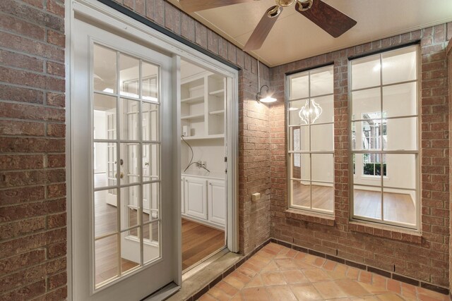 1327 Mission Chase Dr, Houston, TX 77077 - wine room featuring brick wall and a ceiling fan