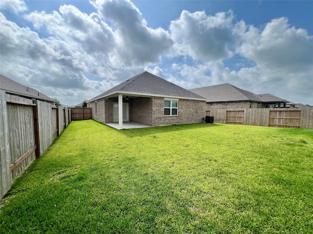 3008 Myrtle Sunset Dr, Katy, TX 77493 - rear view of property featuring a patio, a fenced backyard, brick siding, and ceiling fan