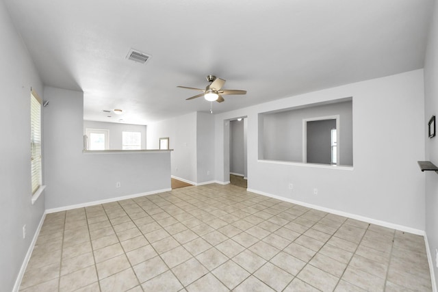 12047 Madison Oak St, Houston, TX 77038 - spare room featuring ceiling fan, tile patterned flooring, and baseboards