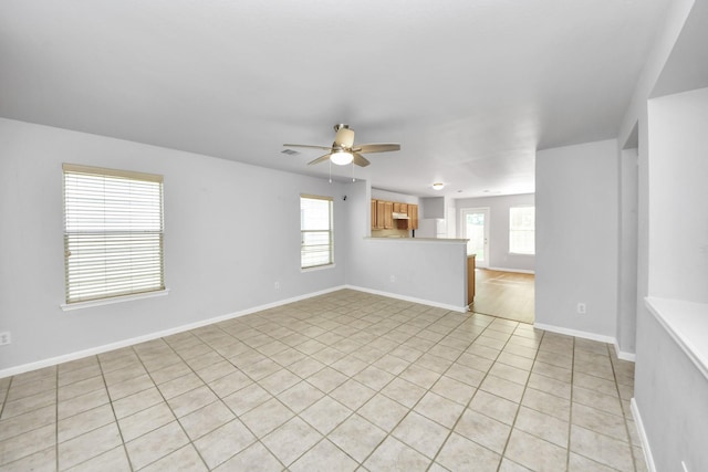 12047 Madison Oak St, Houston, TX 77038 - unfurnished room with a ceiling fan, light tile patterned floors, and baseboards