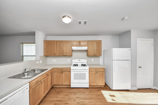 12047 Madison Oak St, Houston, TX 77038 - kitchen with white appliances, under cabinet range hood, a sink, light wood finished floors, and light countertops