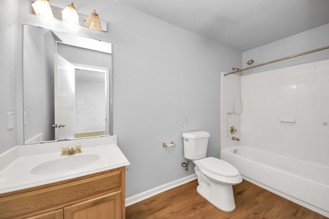 12047 Madison Oak St, Houston, TX 77038 - bathroom with toilet, wood finished floors, vanity, washtub / shower combination, and baseboards